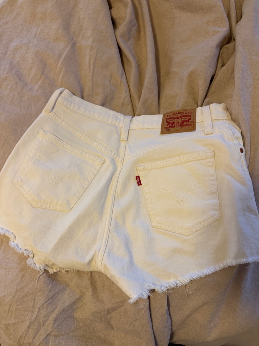 Levi's White Denim Frayed Hem Cutoff Shorts